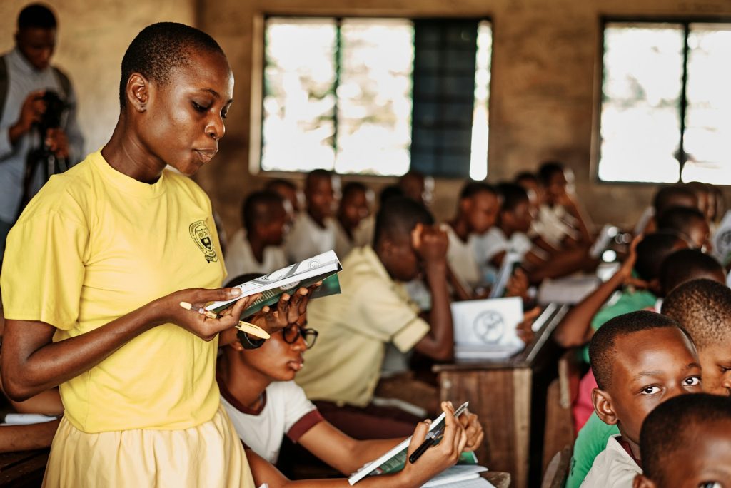 Facilitator in front of a group of children